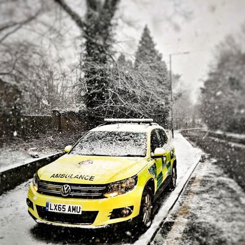 London Ambulance on snowy road Christmas ecard