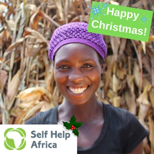 African lady smiling 'Happy Christmas!' Christmas ecard