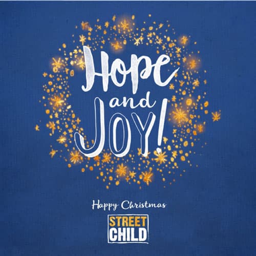 Gold stars behind 'Hope and Joy!' Christmas ecard